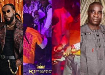 Moment Burna Boy rains money on K1 at Lagos restaurant (Watch video)