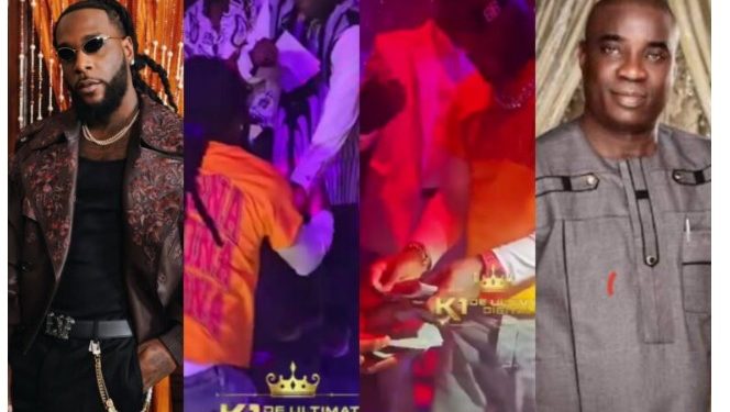 Moment Burna Boy rains money on K1 at Lagos restaurant (Watch video)